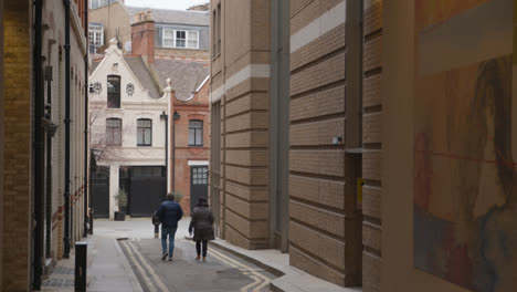 People-Walking-Past-Office-And-Residential-Buildings-In-Bourdon-Street-Mayfair-London
